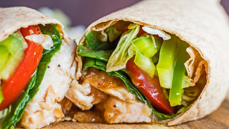 Close up of a Sweet Onion Chicken Teriyaki wrap cut in half