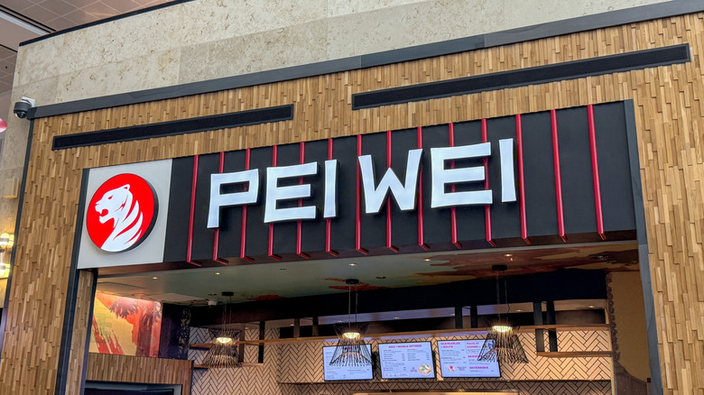 A Pei Wei sign above a Pei Wei restaurant entrance