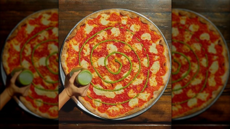 Rubirosa's signature "tie dye" pizza with vodka sauce, tomato sauce, pesto, and mozzarella