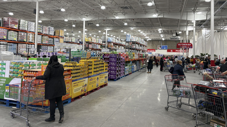 Customers shopping inside Costco warehouse.