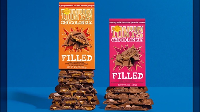 Two flavors of Tony's Chocolonely Filled Bars in package and unwrapped.