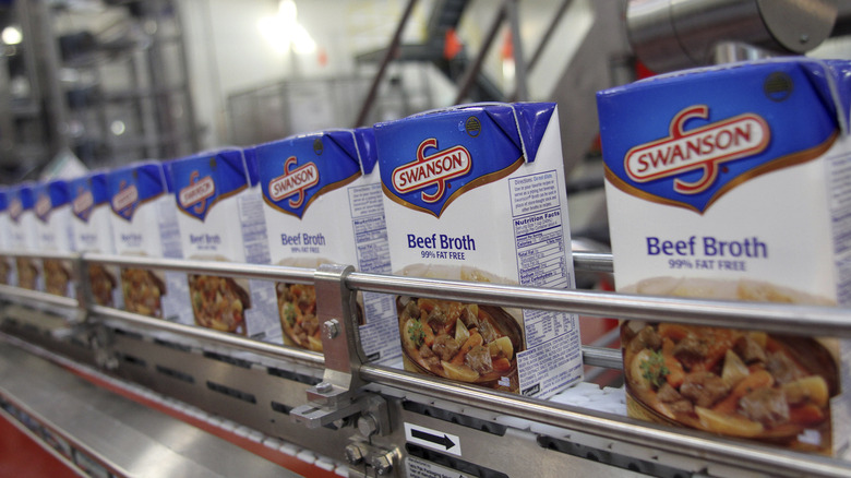 Boxes of beef broth on conveyor belt