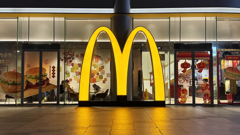 The McDonald's M in front of a McDonald's building.