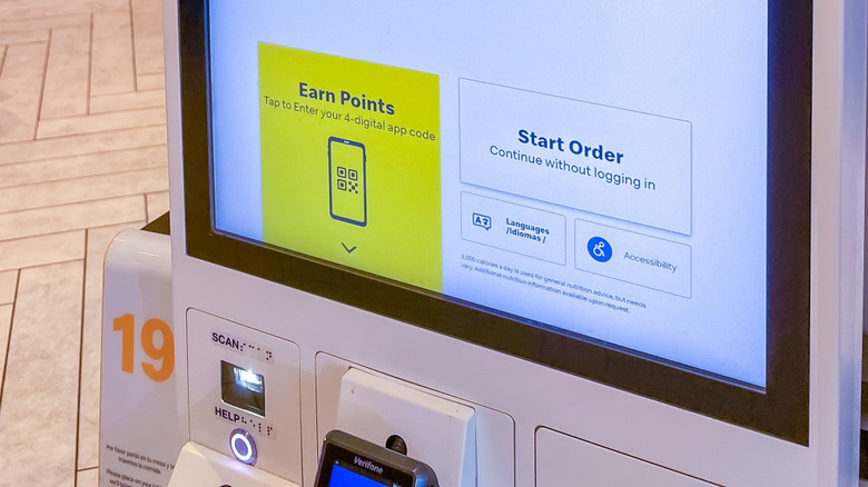 A McDonald's rewards screen on a kiosk.
