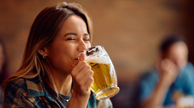 Woman sipping beer