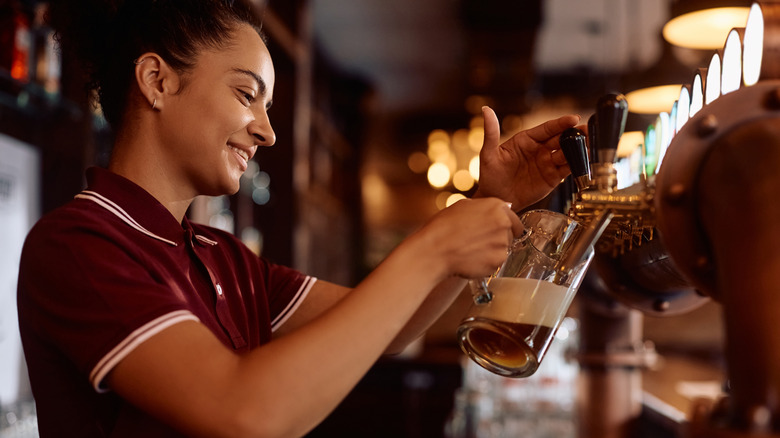 Bartender pulling a pint