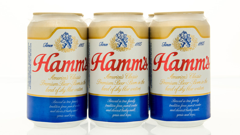 three cans of Hamms beer