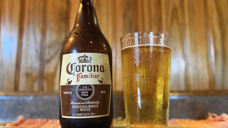 Corona familiar bottle next to beer glass
