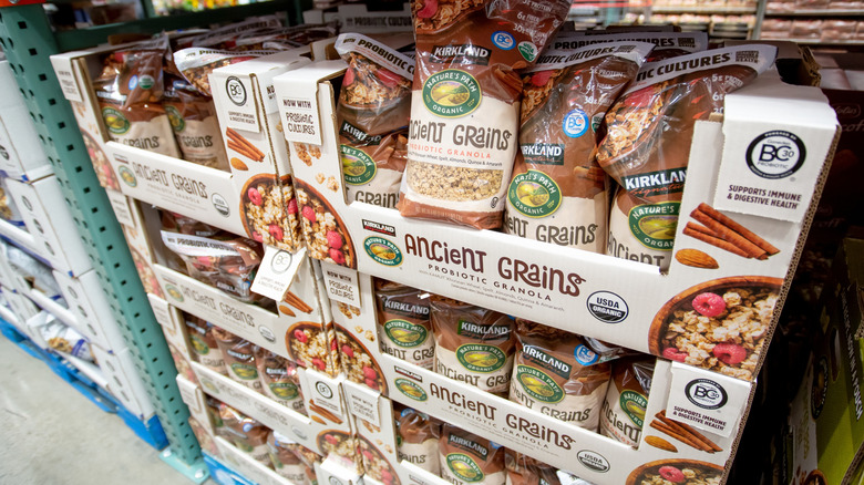 Bags of Kirkland Signature Organic Ancient Grains Granola in a Costco store