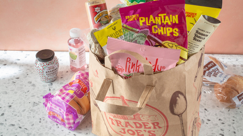 Groceries in paper Trader Joe's bag