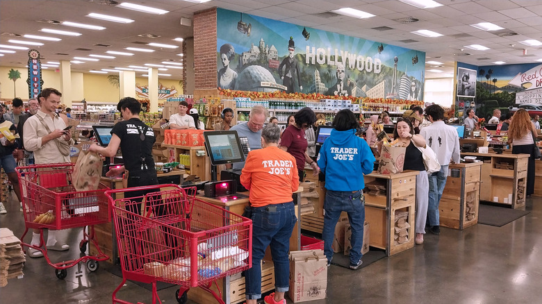 Trader Joe's employees serving customers at the registers