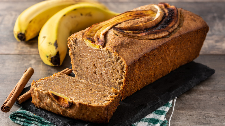 Loaf of banana bread with bananas