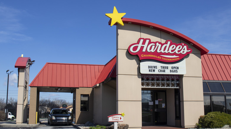Facade and drive-thru lane of a Hardee's restaurant