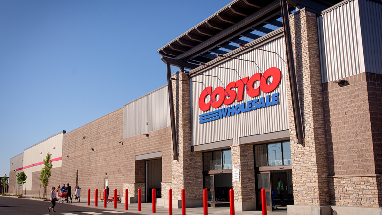 Costco Wholesale storefront with customers walking