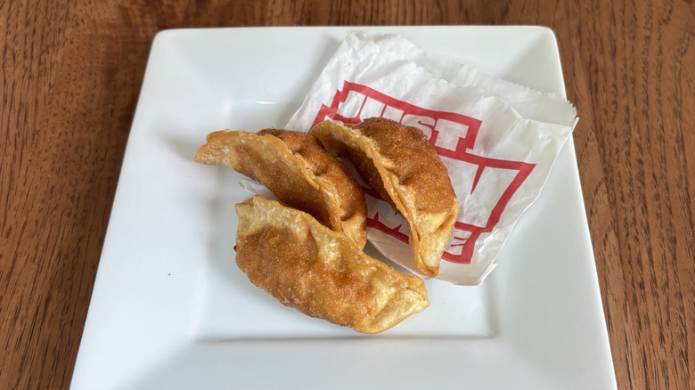 three fried pork stickers on a plate