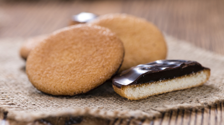 A pile of Jaffa cakes with one sliced in half