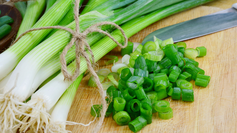 Green onions on a board