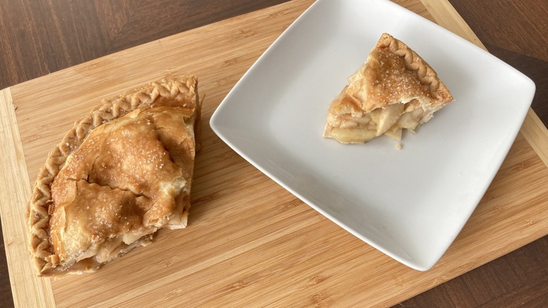 Albertsons apple pie on plate and wooden cutting board