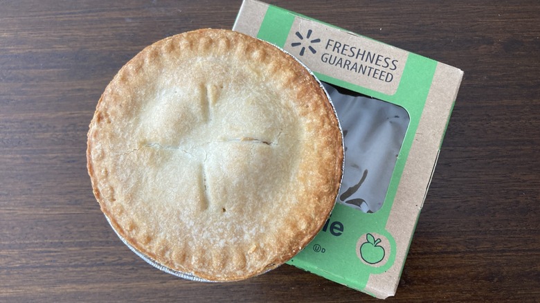 Freshness Guaranteed mini apple pie on wooden table