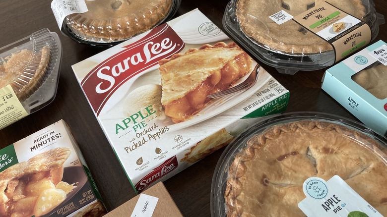selection of grocery store pies on wooden table