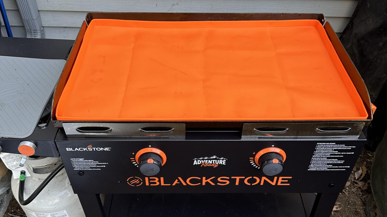 An orange silicone mat for the Blackstone