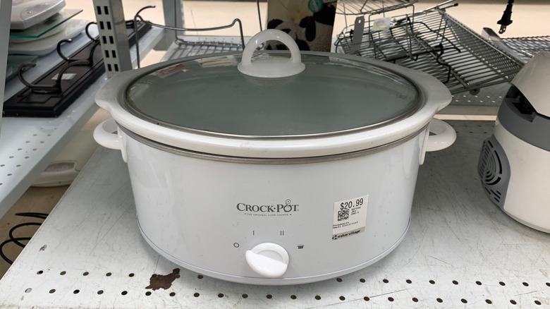 slow cooker on thrift store shelf