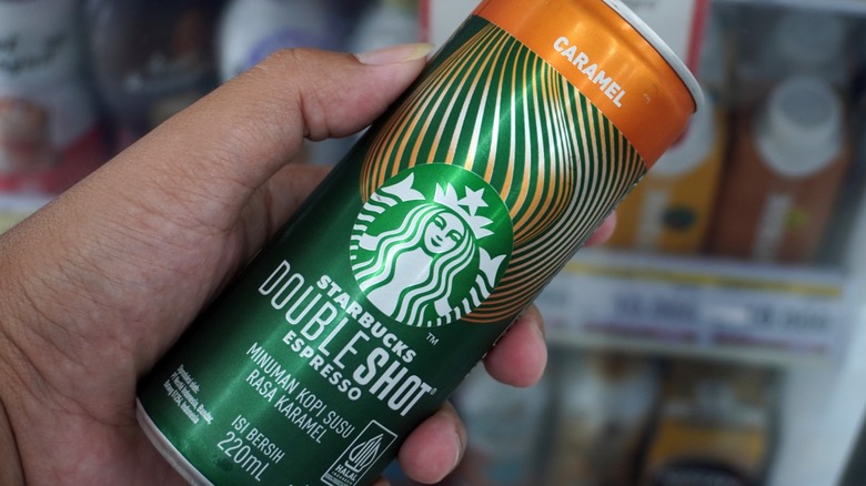 hand holding can of Doubleshot Espresso