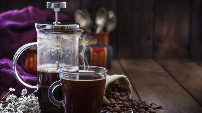 French press with cup of coffee