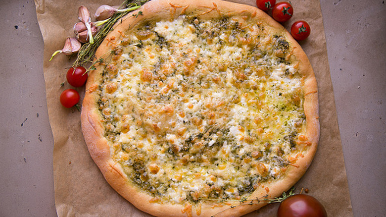 aerial photo of stuffed crust pizza on a piece of parchment paper