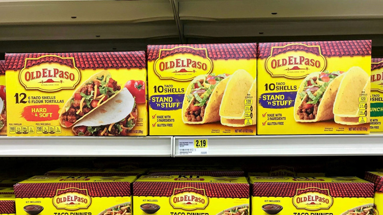 boxes of Old El Paso taco kits on a grocery store shelf