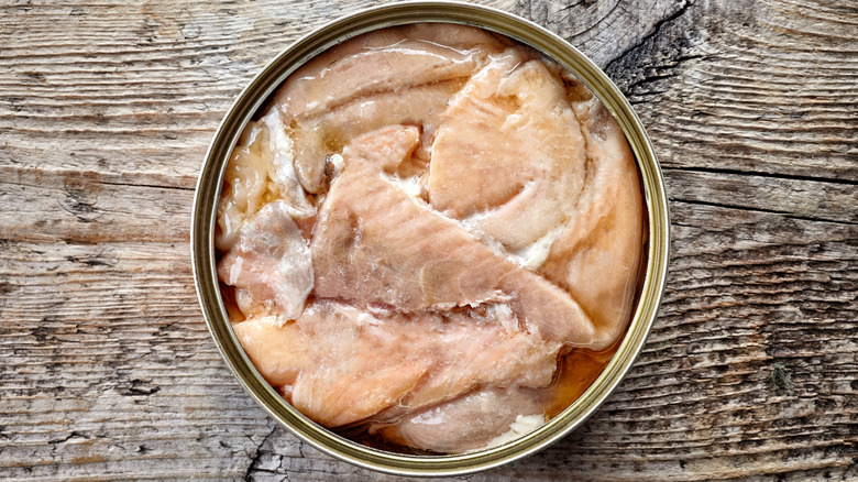 Open tin of canned salmon viewed from the top