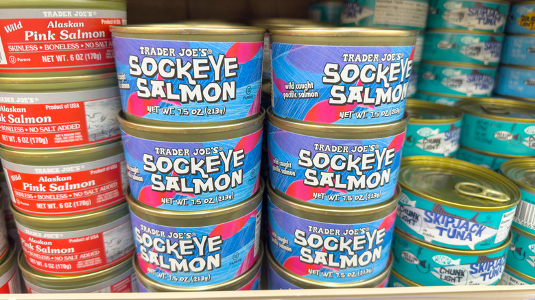 Cans of salmson on a grocery store shelf