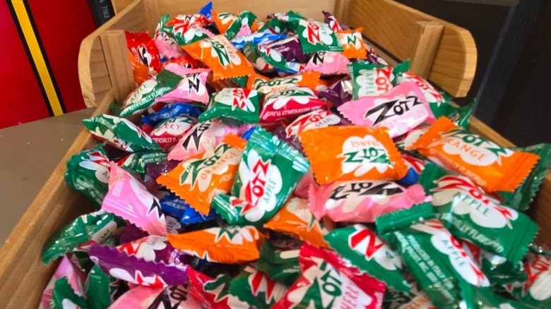 Close-up on a wooden crate full of Zots candies