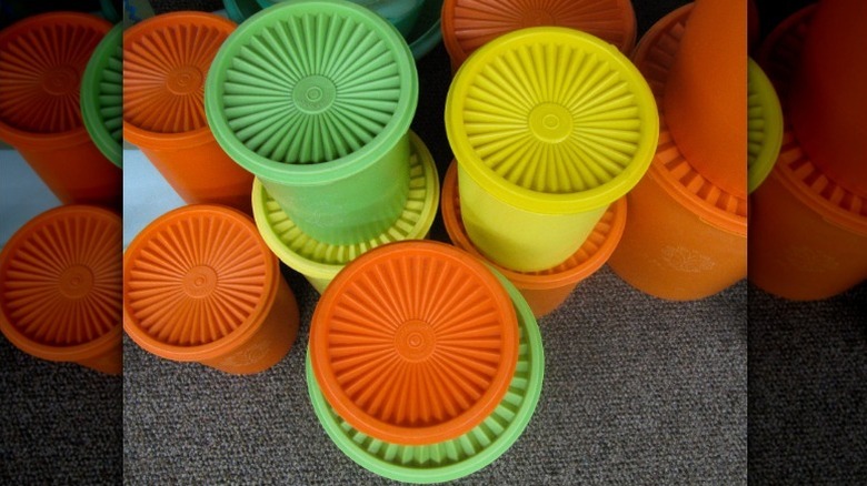 stacks of green, orange and yellow tupperware