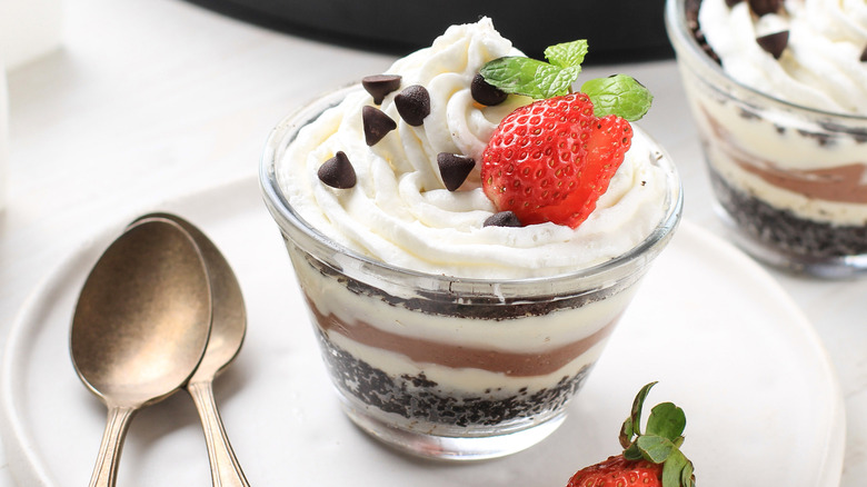 A serving of chocolate lasagna in a glass cup