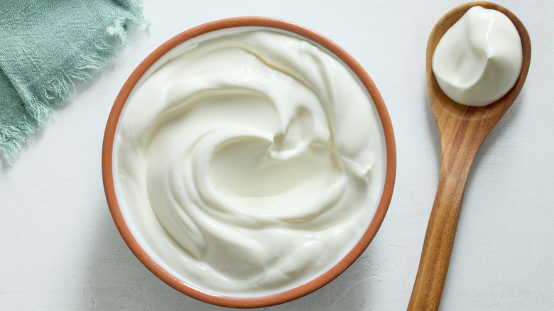 sour cream in bowl with spoon