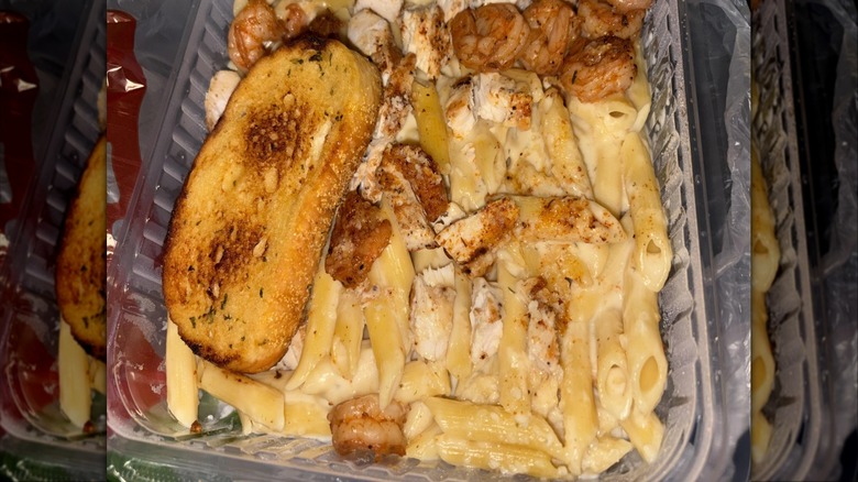 Chili's cajun chicken pasta and shrimp with slice of bread