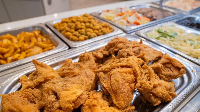 Fried chicken and various side dishes on the buffet line at Golden Corral