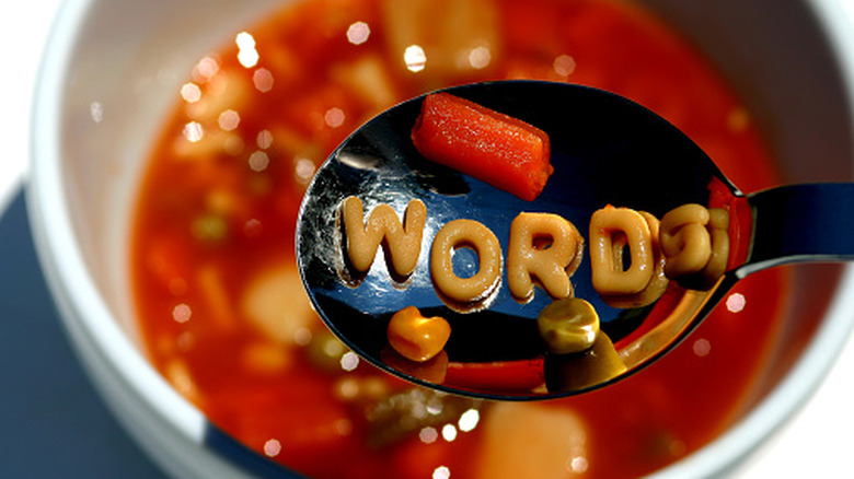 alphabet soup close up of words in spoon