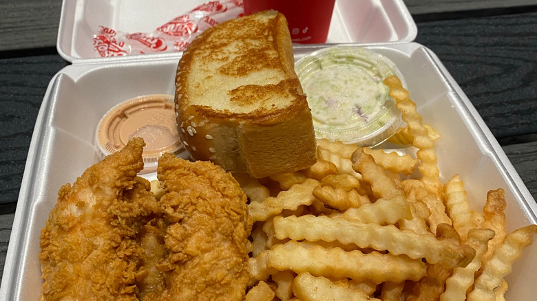 Texas toast on top of Raising Cane's meal