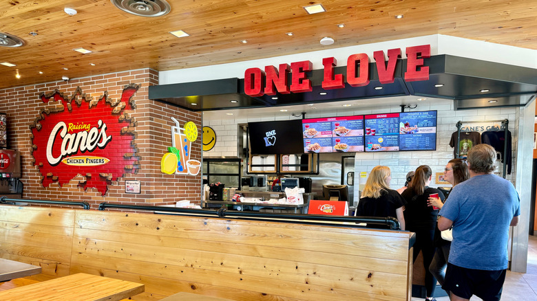 one love Raising Cane's sign