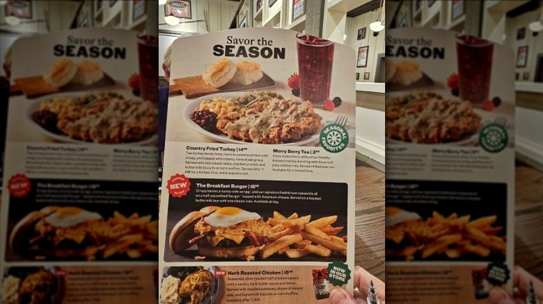 Cracker Barrel's holiday seasonal menu held by a person off camera