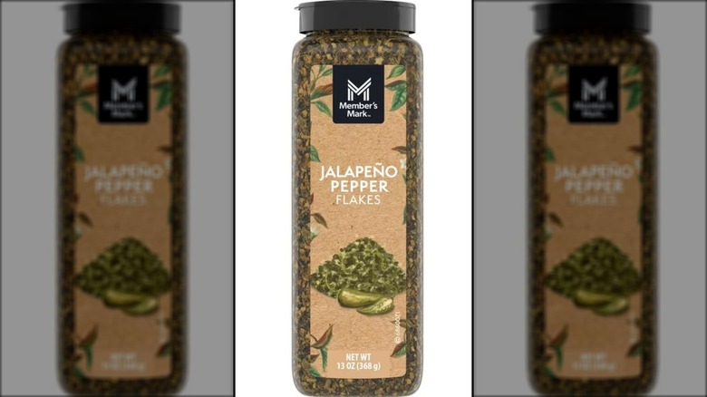 Container of jalapeño pepper flakes.