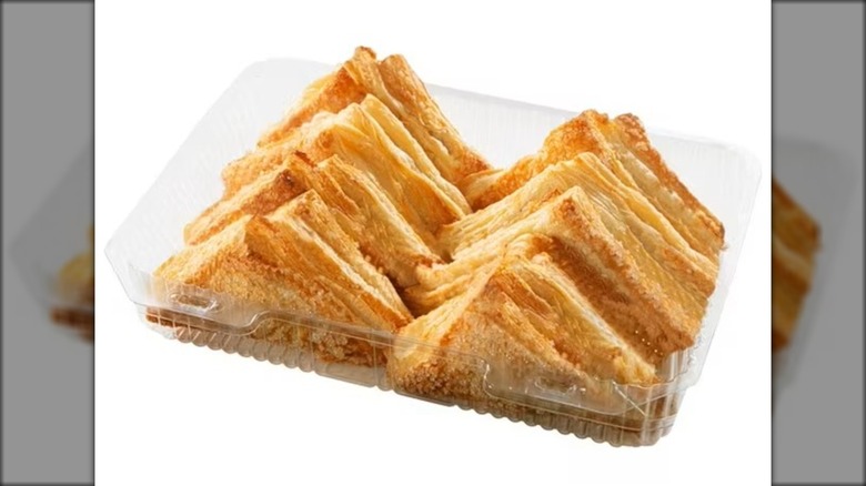 Plastic package with baked apple turnovers.
