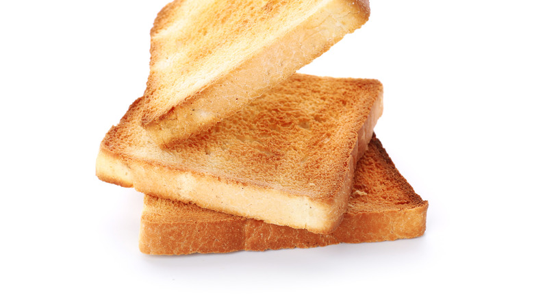 Slices of toasted bread isolated on white