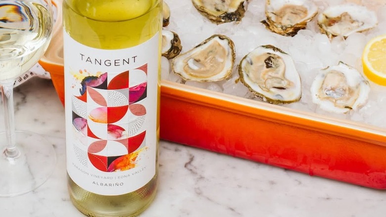 Bottle of Tangent Albarino with oysters