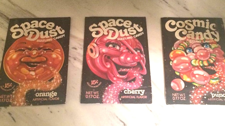 Packets of orange, cherry, and punch-flavored Space Dust