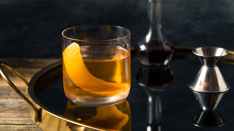 A Fancy Free cocktail on metal tray