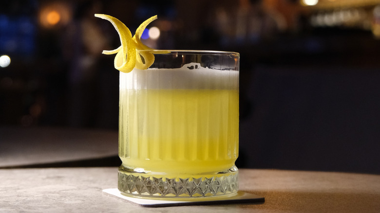 A Whiskey Sour on wooden table