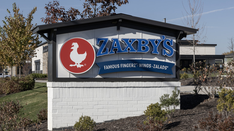 Zaxby's sign amidst foliage